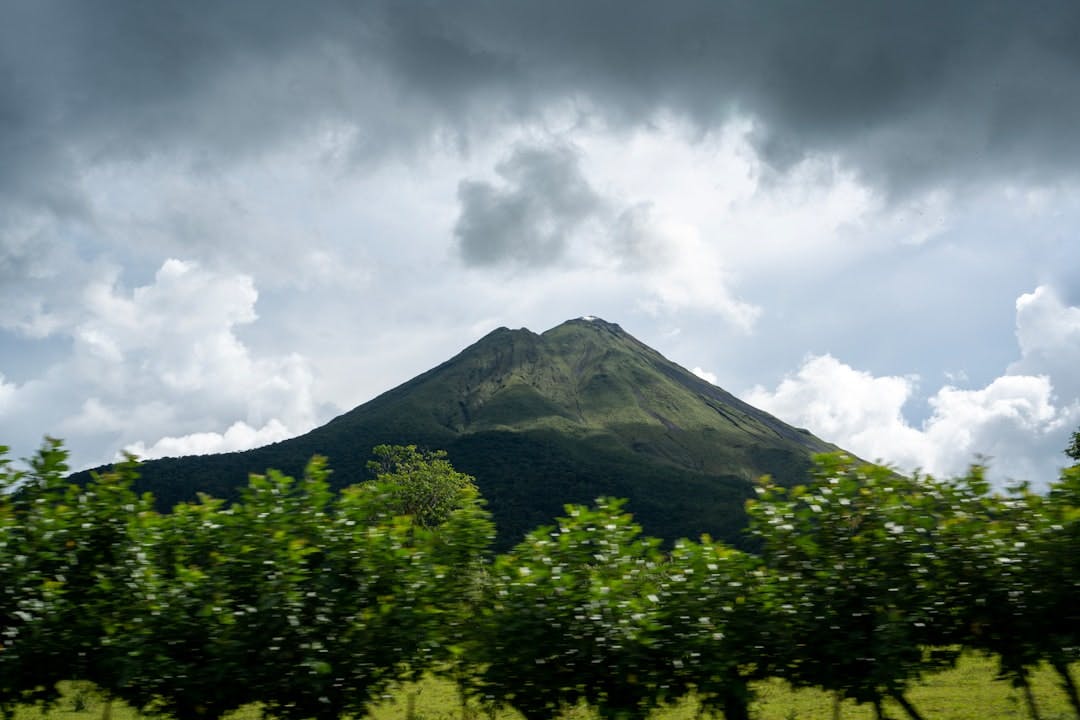a view of a mountain from a moving vehicle
